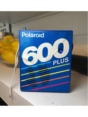 Vintage Polaroid 600 Plus promotional AM/FM novelty transistor radio